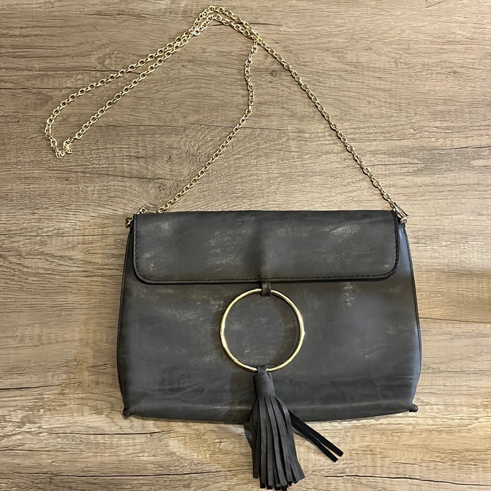 Banyan Tree grey clutch with ring and fringe detail with crossbody chain